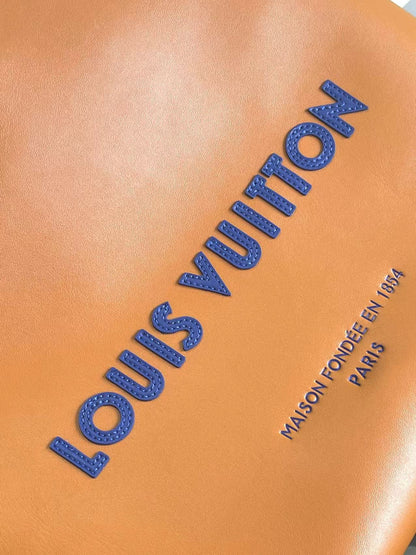 Stylish Orange Louis Vuitton Tote Bag With Blue Handles And Branding