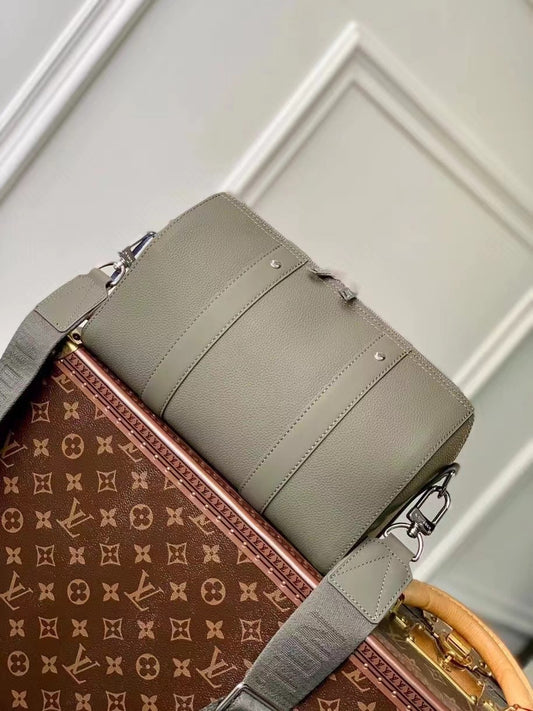 Chic Olive Green Louis Vuitton Crossbody Bag With Textured Leather And Signature Details