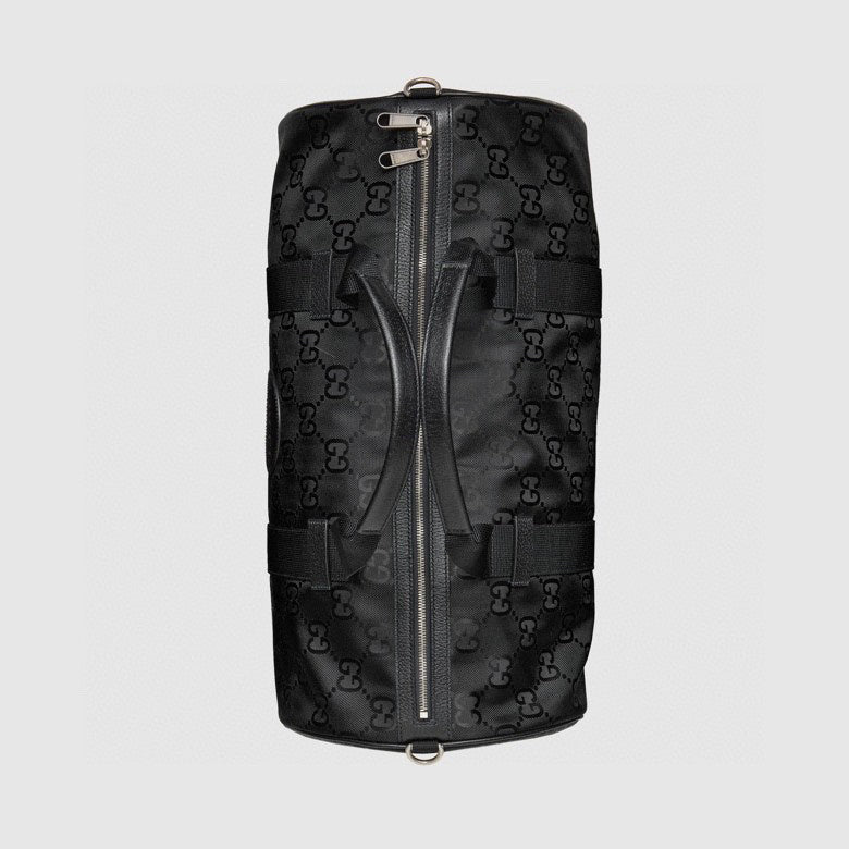 Elegant Black Gucci Duffle Bag With Signature GG Pattern And Gold Branding 658632
