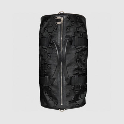 Elegant Black Gucci Duffle Bag With Signature GG Pattern And Gold Branding 658632