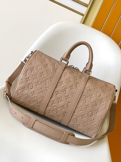 Louis Vuitton Embossed Leather Keepall Bandoulière Bag in Beige for Luxury Travel and Style