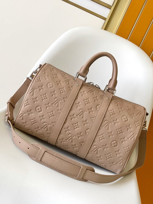 Louis Vuitton Embossed Leather Keepall Bandoulière Bag in Beige for Luxury Travel and Style