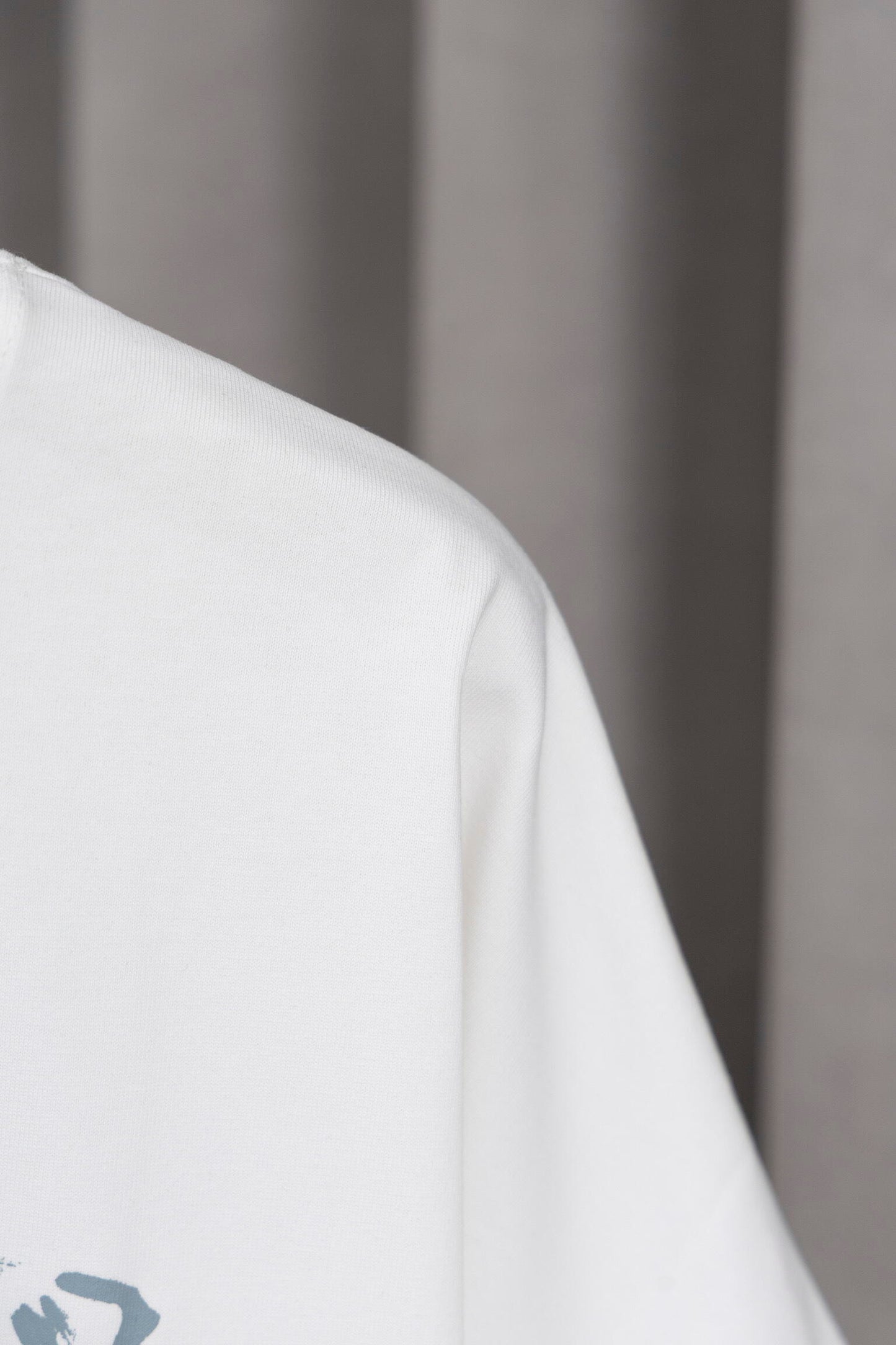 Prada Black/White Tee With Iconic Triangle Logo For Sophisticated Streetwear Looks