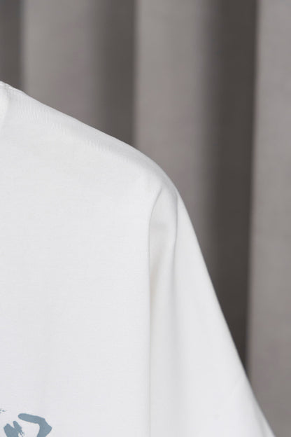 Prada Black/White Tee With Iconic Triangle Logo For Sophisticated Streetwear Looks