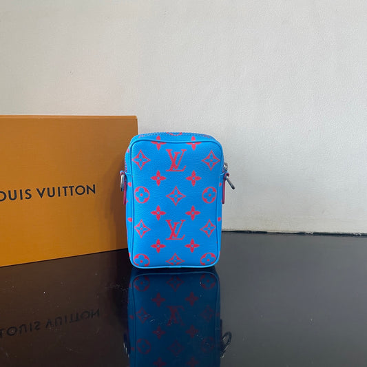 Eye Catching Blue Louis Vuitton Crossbody Bag With Red Monogram Pattern And Adjustable Strap