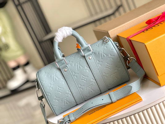 Gorgeous Light Blue Louis Vuitton Speedy Bandoulière Embossed Leather Handbag