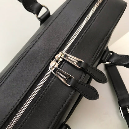 Sleek Black Burberry Briefcase With Woven Texture For Sophisticated Business And Travel Looks