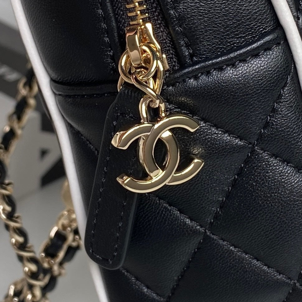 Chanel Quilted Black Leather Mini Backpack with White Trim and Gold - Tone Chain Straps AP4514