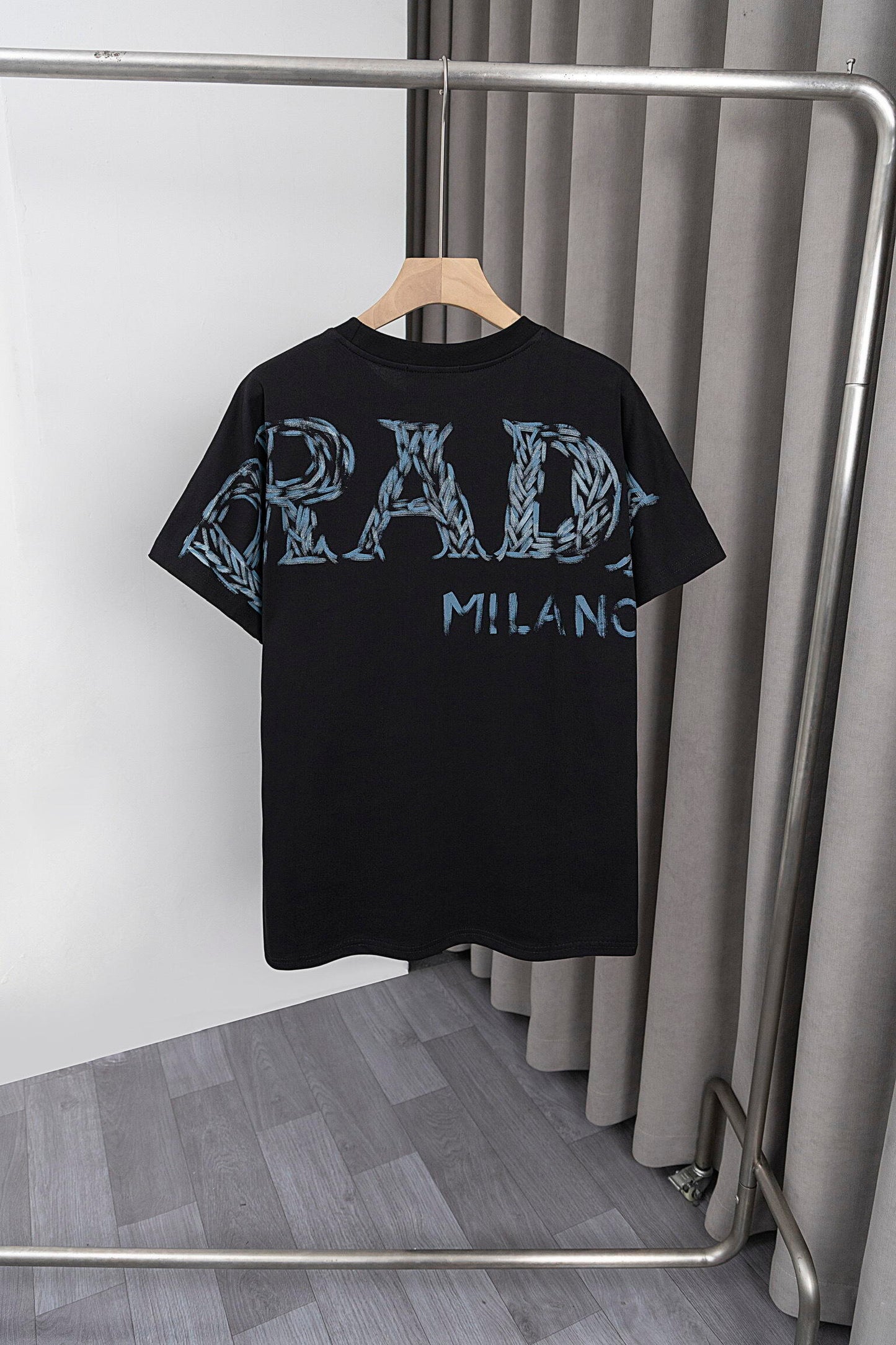 Prada Black/White Tee With Iconic Triangle Logo For Sophisticated Streetwear Looks