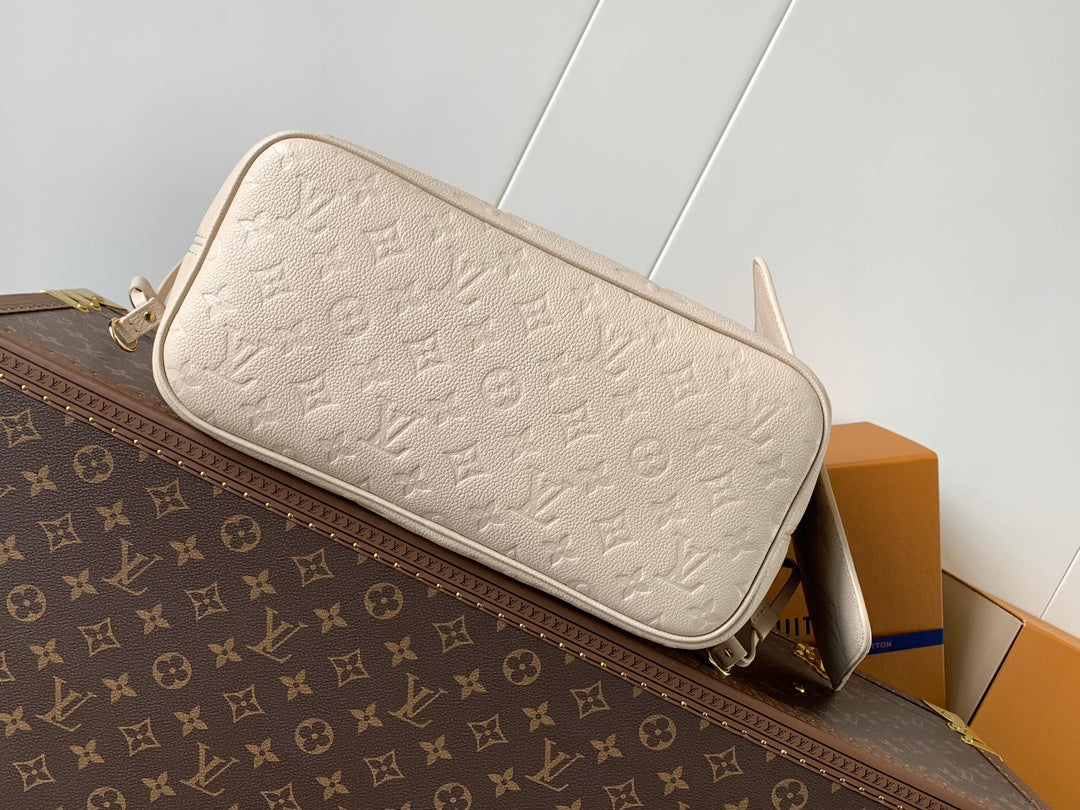 Elegant Louis Vuitton Cream Empreinte Leather Neverfull Tote Bag for Fashion Enthusiasts