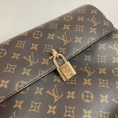 Classic Louis Vuitton Monogram Canvas Handbag With Lock Detail And Stylish Design
