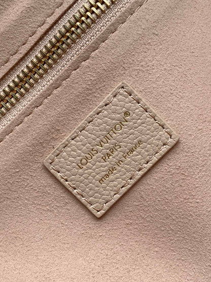 Elegant Louis Vuitton Cream Empreinte Leather Neverfull Tote Bag for Fashion Enthusiasts