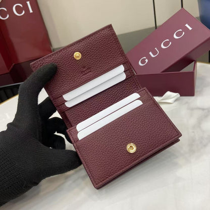 Elegant Black Gucci Wallet With Iconic Gold GG Logo For Timeless Luxury Accessory 456126