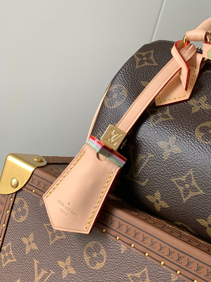Louis Vuitton Speedy Bandoulière Bag With Colorful Charms And Stylish Strap For Fashion Enthusiasts
