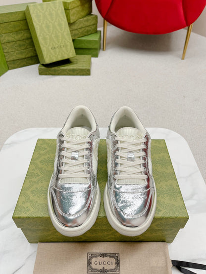 Stylish White And Pink Gucci Sneakers On Display